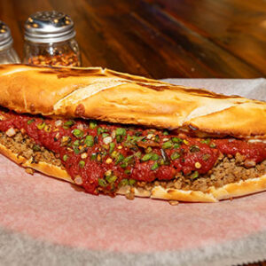 Wicked Stromboli, Crumbled Sausage, Wicked (Secret) Sauce, Cheese, Green Peppers, Onions This one has a Kick!