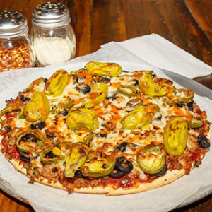 El Diablo Wicked Base, Italian Sausage, Crumbled Sausage, Black Olives, Green Peppers, Jalapeños, Crushed Red Peppers, Pepperoncini, Hot Sauce